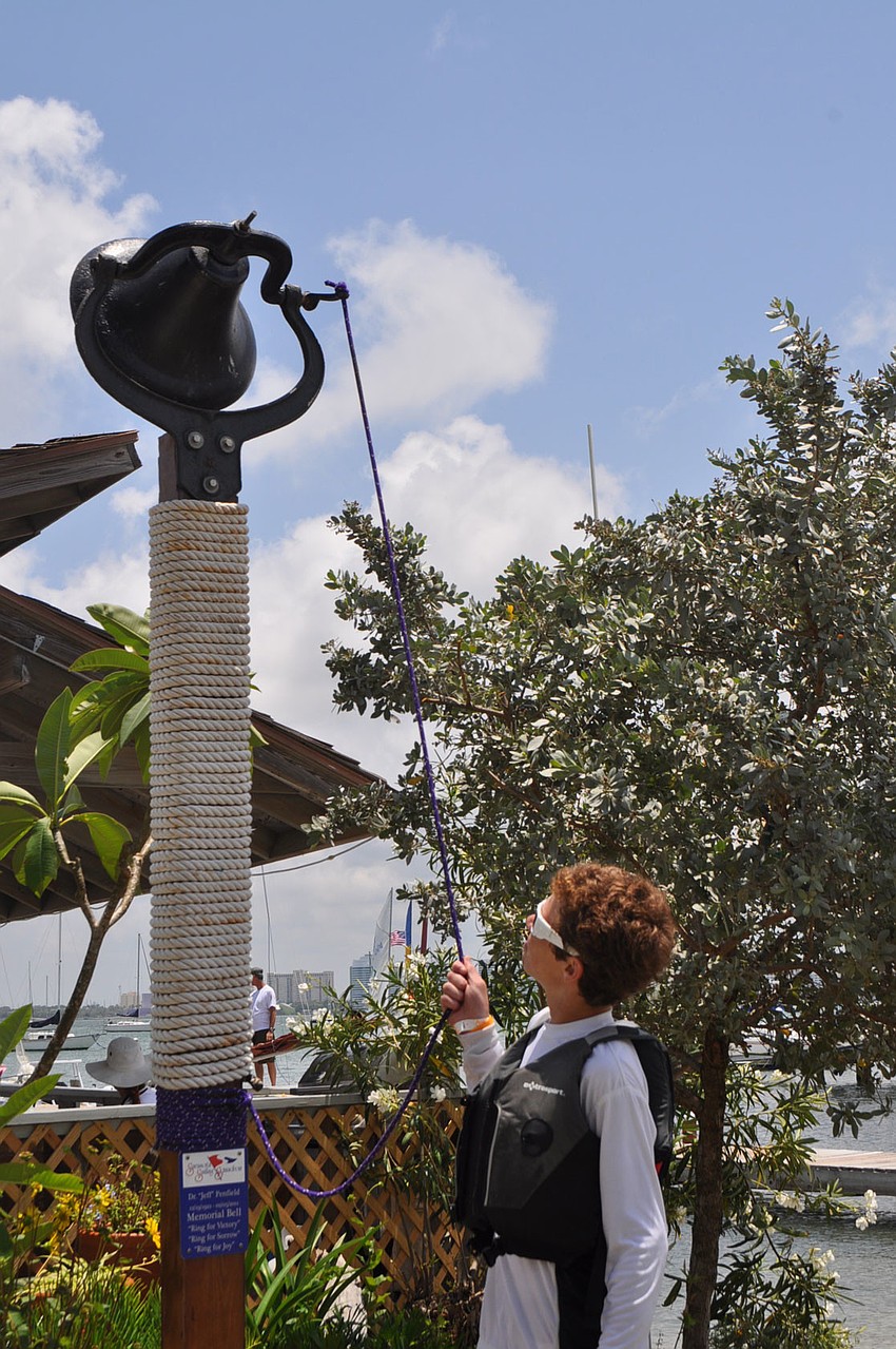Ben Kalish rang the finish-line bell May 28 during Sarasota Sailing Squadronâ€™s annual Race Around Lido.