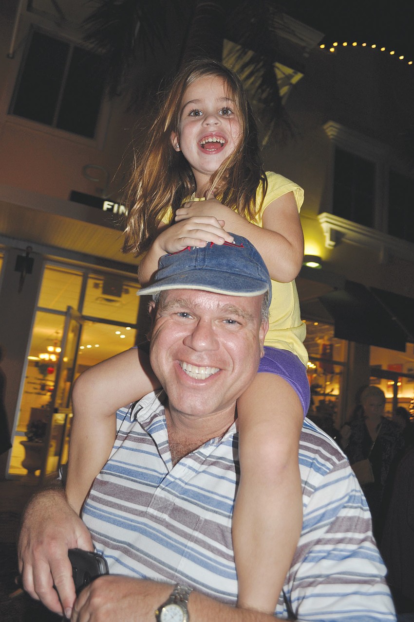 David Korman gives his daughter, Zoe, 5,a ride, during a 