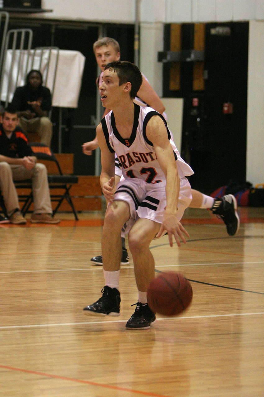 Sarasota High Schoolâ€™s Blake Haga, No. 12, dribbles the ball.