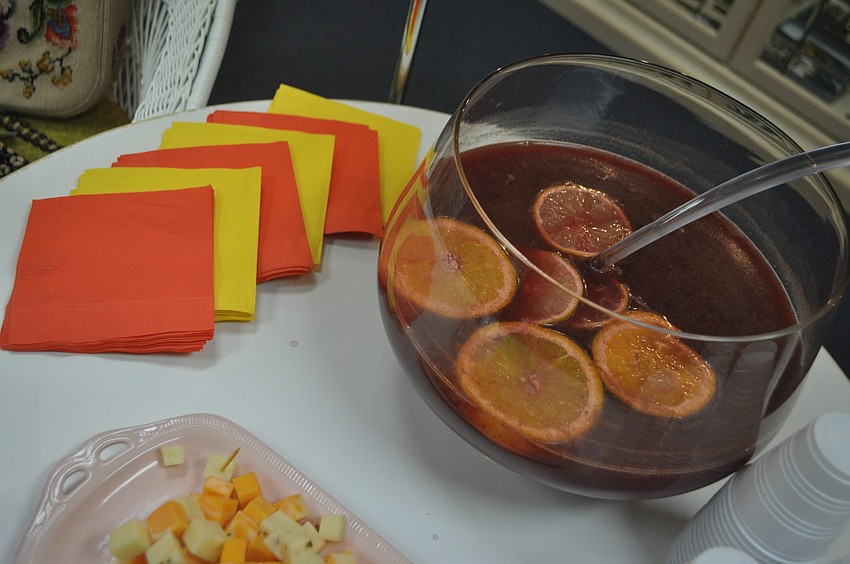 Retailers set out refreshments for the occasion. Stephanie Claussen, of Steffâ€™s Stuff Antiques, prepared sangria using her daughterâ€™s special recipe.