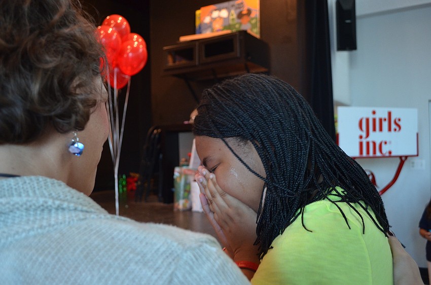 Tears stream down Zandy Sander's face as she hears the news.