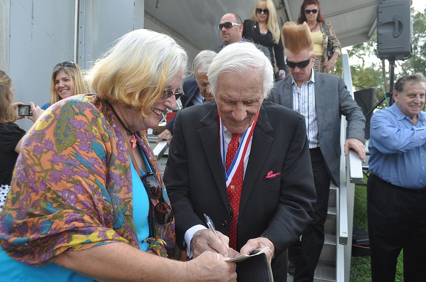 Gale Midwood, an associate member of Showfolks, asks Ring of Fame Inductee Charles Coronas for his autograph.