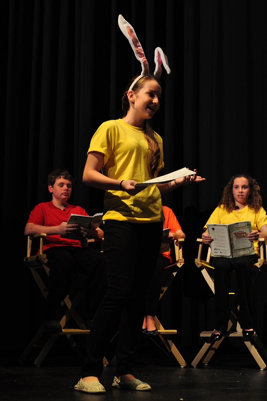 Rabbit, portrayed by Anne Kean, tries to understand a note left by Christopher Robin.