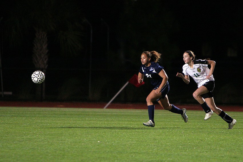 ODAâ€™s Sierra Dickerson, No. 21, and Shorecrest's Jade Caswell, No. 11, both go after the ball.
