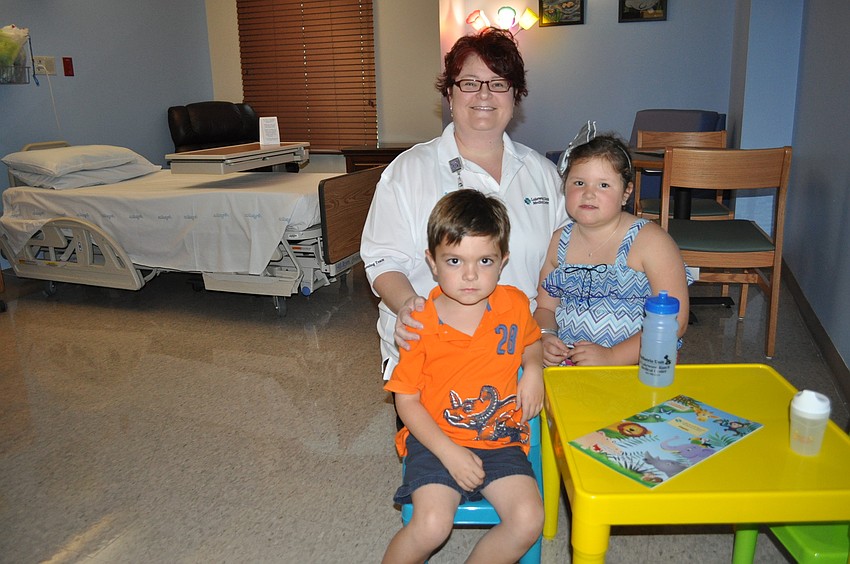 Kim Robbins, a Lakewood Ranch Medical Center nurse, with her children Wyatt and Avery