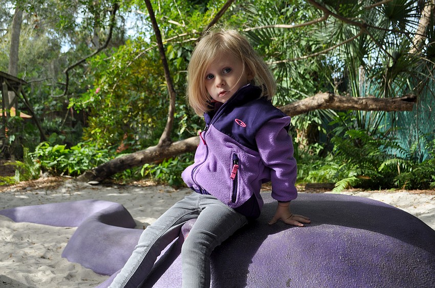 Madeline Gersh plays in the Childrenâ€™s Garden.