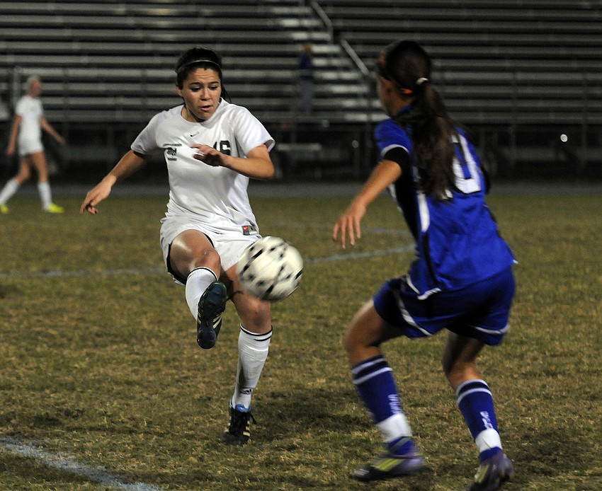 Lakewood Ranch midfielder Lindsay Martinez fights for passion in the first half.