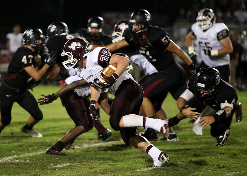 Chris Werker, No. 36, makes his way past the Braden River defense to gain some extra yards for Riverview Friday, Sept. 21 during the Braden River versus Riverview game at Braden River.