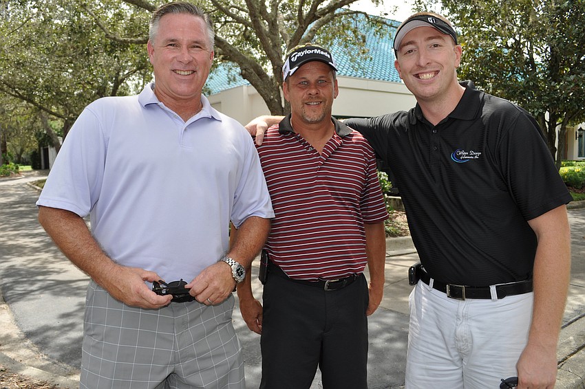 Joe Dudash, Tim Williams and Kevin Brown work together.