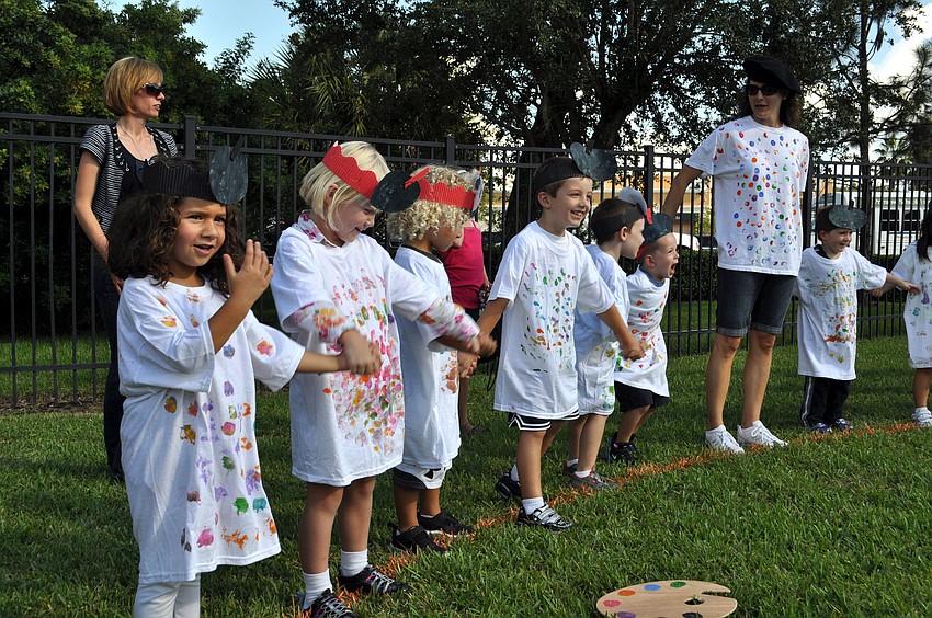 Students hold hands and sing â€œItâ€™s a Small World.â€