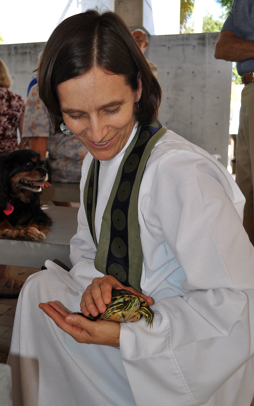 Associate Rector Andi Taylor blesses Easter, 23, at the Animal Blessing Sunday, Sept. 30 at St. Boniface Episcopal Church.