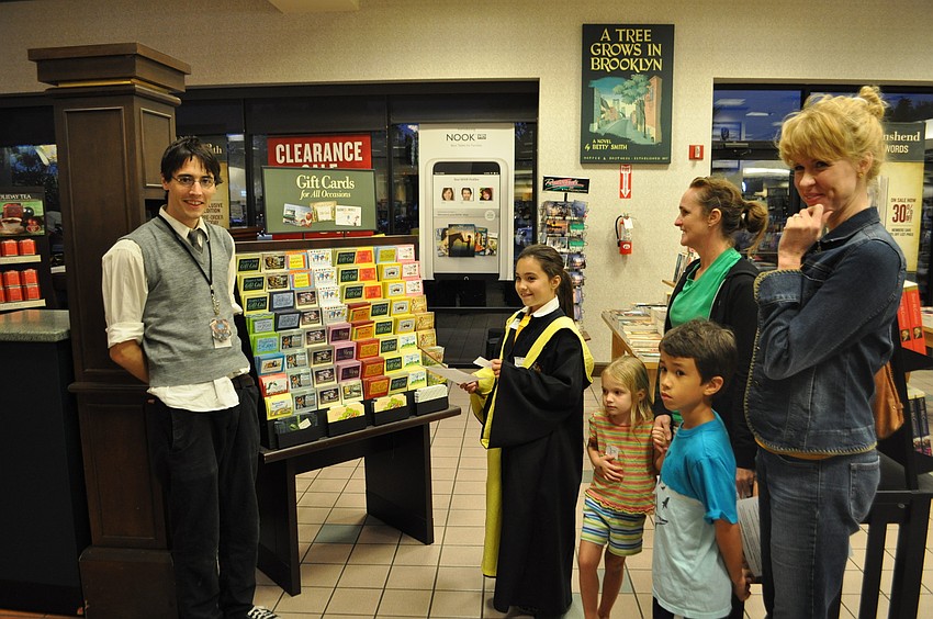 Ethan Gorham guides visitors through the scavenger hunt.