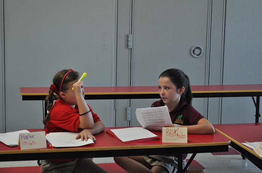 Harlee Hopson and Riley Kuhn review their campaign speeches.