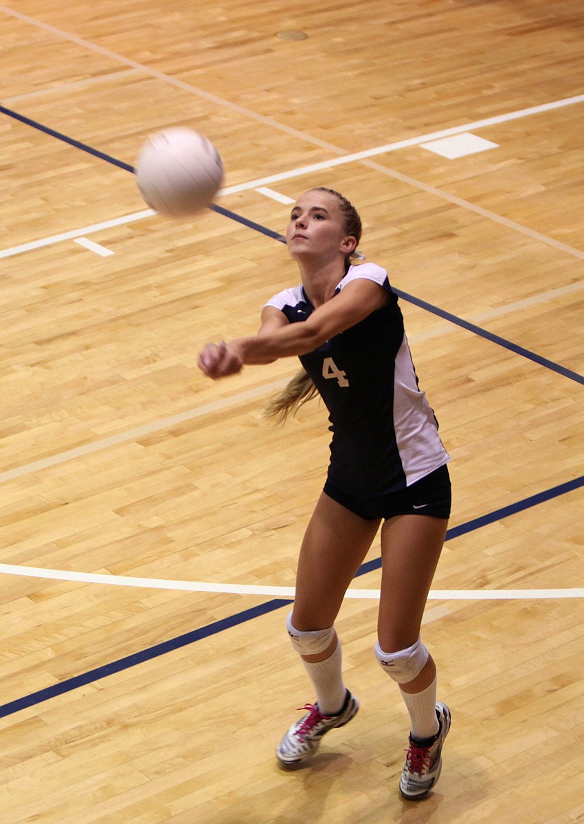 Natalie Buffett, No. 4, bumps the ball.