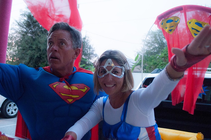 Ginger Rosenberger, the IB coordinator, and her husband Greg set up a Superman themed vehicle where kids trick â€˜oâ€™ trunked.