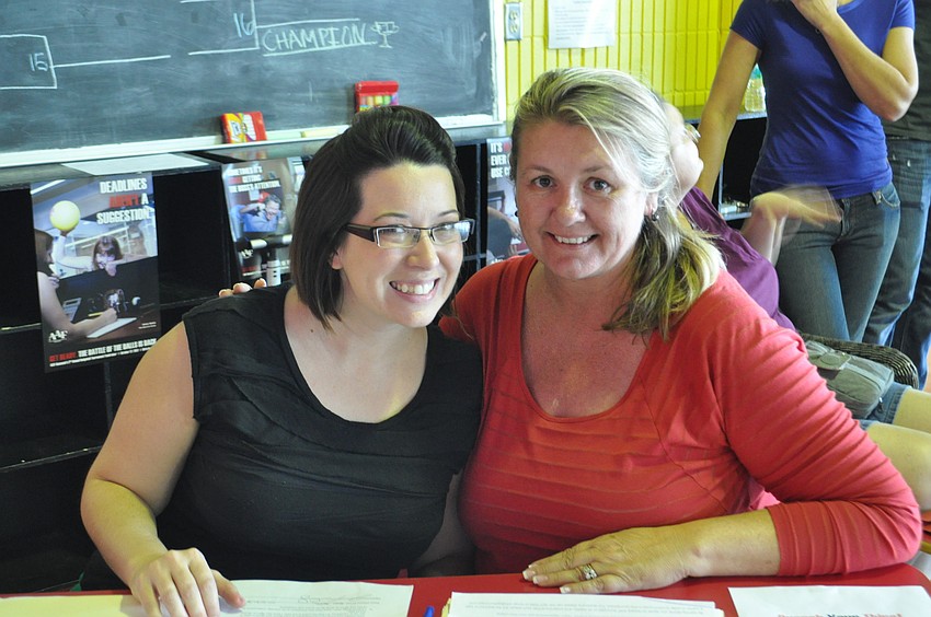 Lindsey Nickel and Katherine Woosley work the registration desk.
