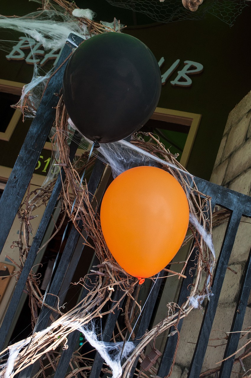 Businesses had black and orange balloons outside to indicate they had candy for trick-o-treaters.