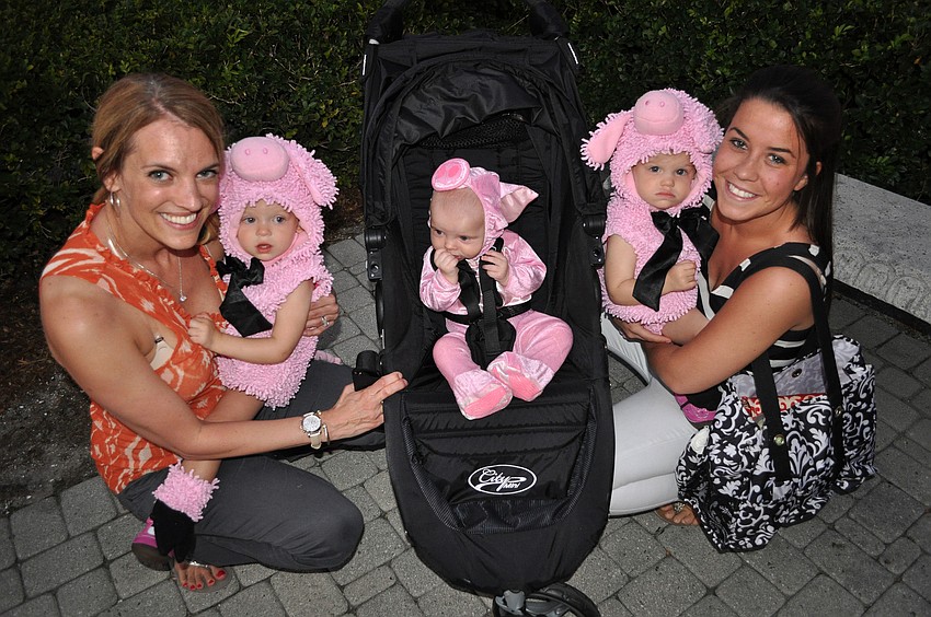 Daphne Jurgensen and Carissa Vonier with Claire, 18 mos., JR, 5 mos., and Chloe, 18 mos., dressed as the three little pigs.