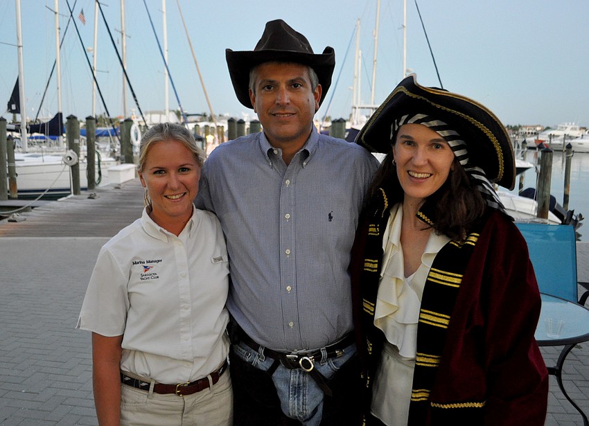 Amanda Holm, Commodore Lee Goodman and his wife, Courtney