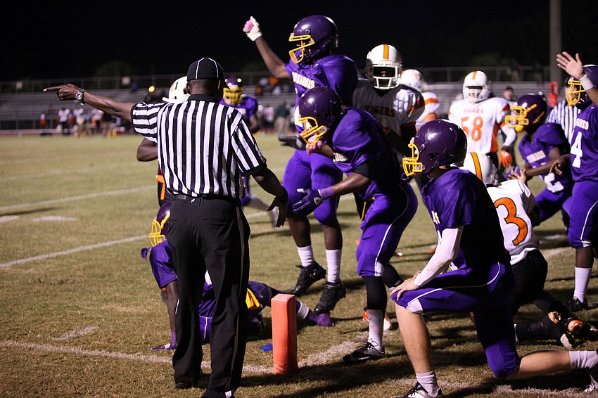 The Booker Tornadoes react to a call made by the ref in their favor.