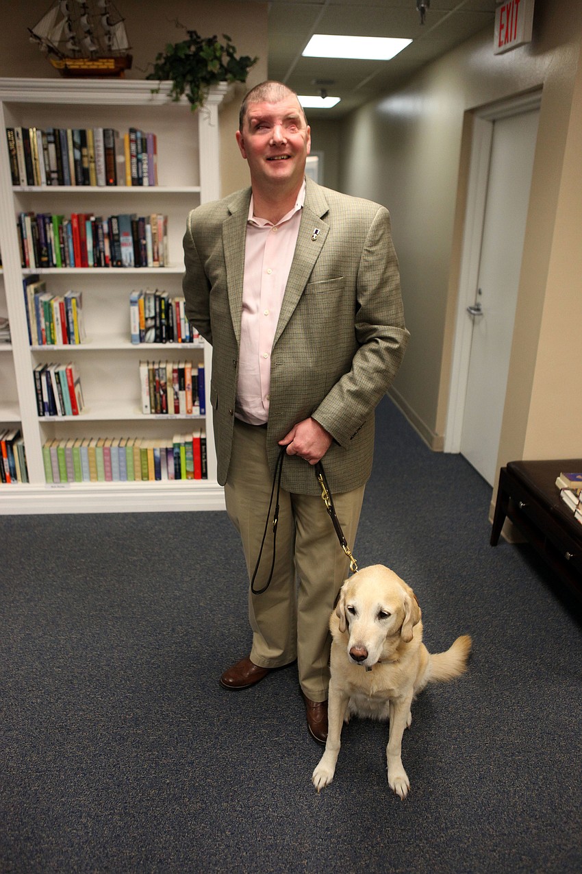 Corporal Michael Jernigan, USMC, Ret. with his guide dog, Brittani, 8.