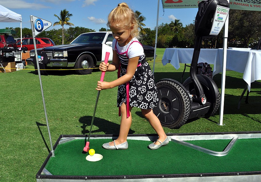 Mallory Sturm, 4, has fun putting.