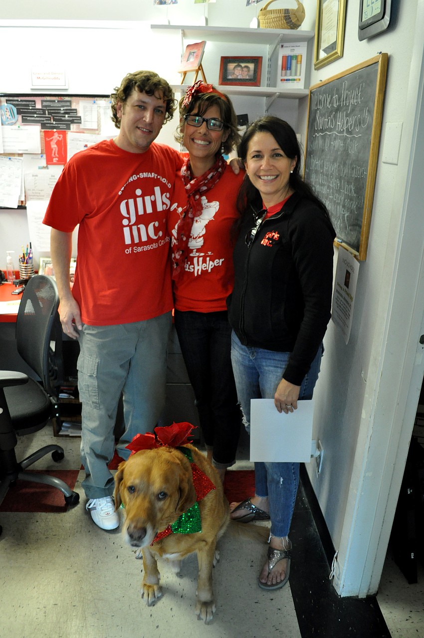 Nathan and Marissa Monroe with Kay Mathers and Dewy the dog.