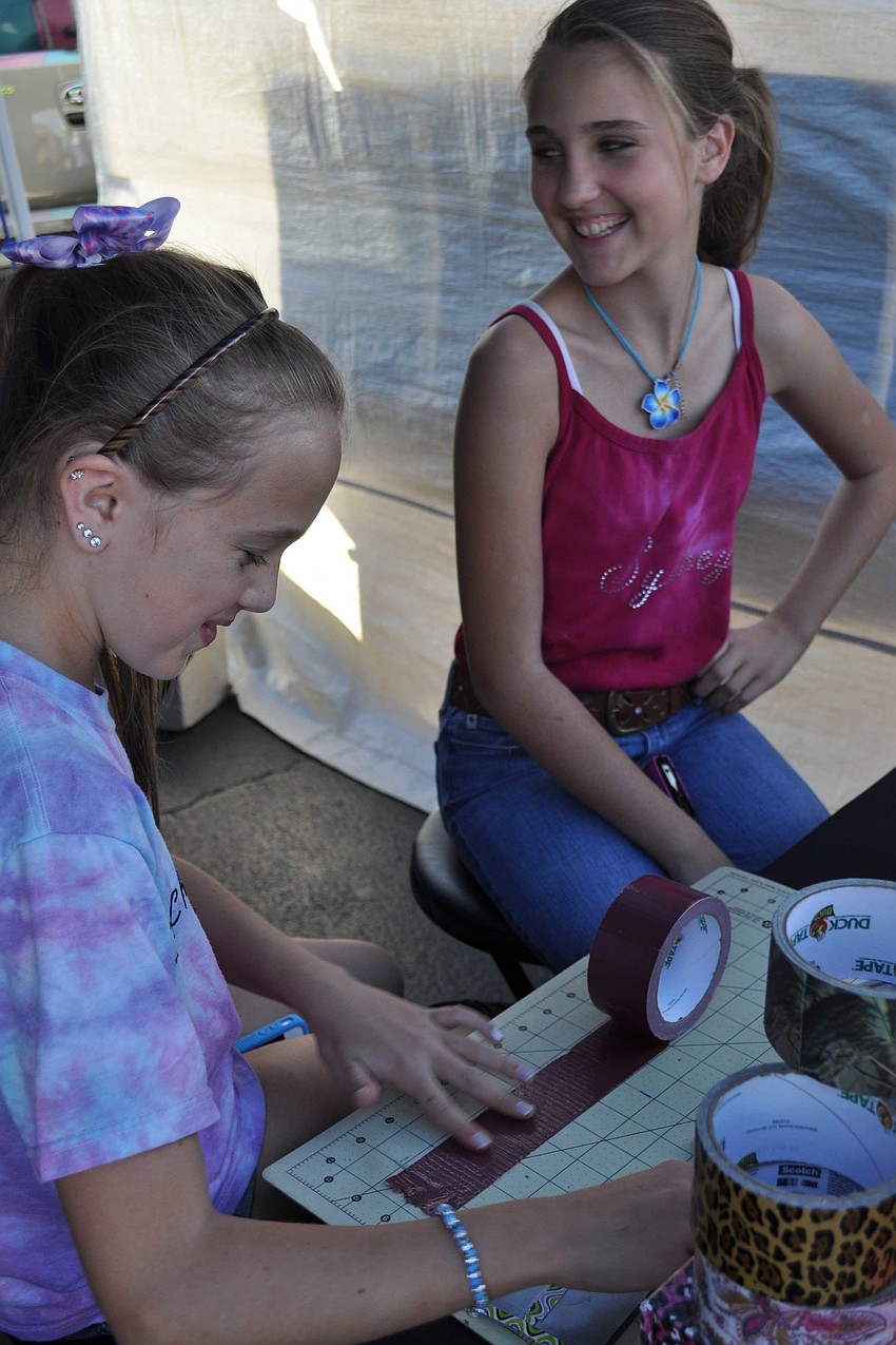Megan Mercier and Sydney Blocker made homemade items out of duct tape.