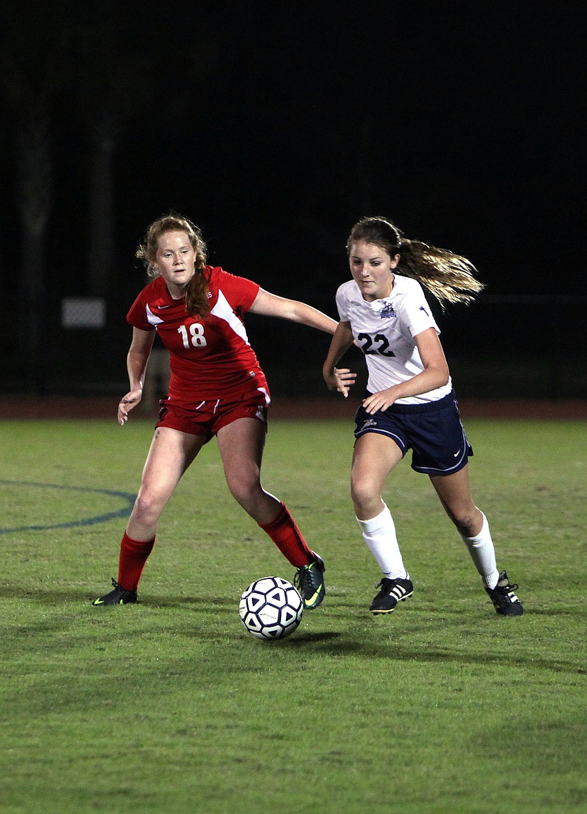 Cardinal Mooney's Alex Byers, No.18, and ODAâ€™s Katie Lang, No. 22, go for the ball.