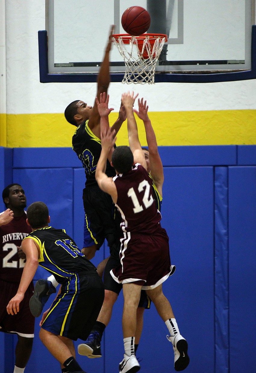 Sarasota Christianâ€™s Sean Carrigan, No. 12, gets the ball into the hoop with a successful lay up Tuesday, Nov. 20, during the game between Riverview and Sarasota Christian at Sarasota Christian.