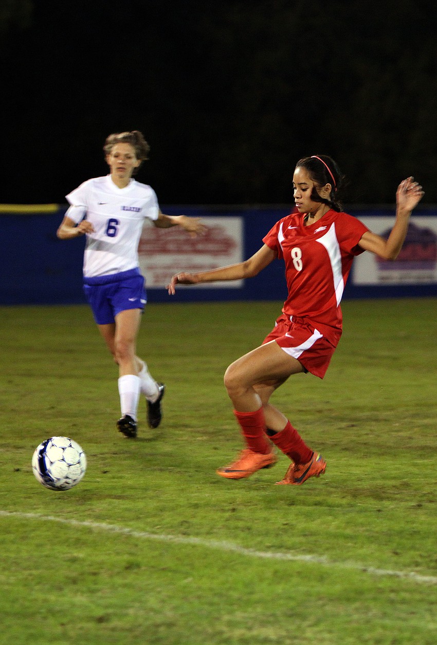 Cardinal Mooneyâ€™s Jasmine Rosales, No. 8, kicks the ball up the field.