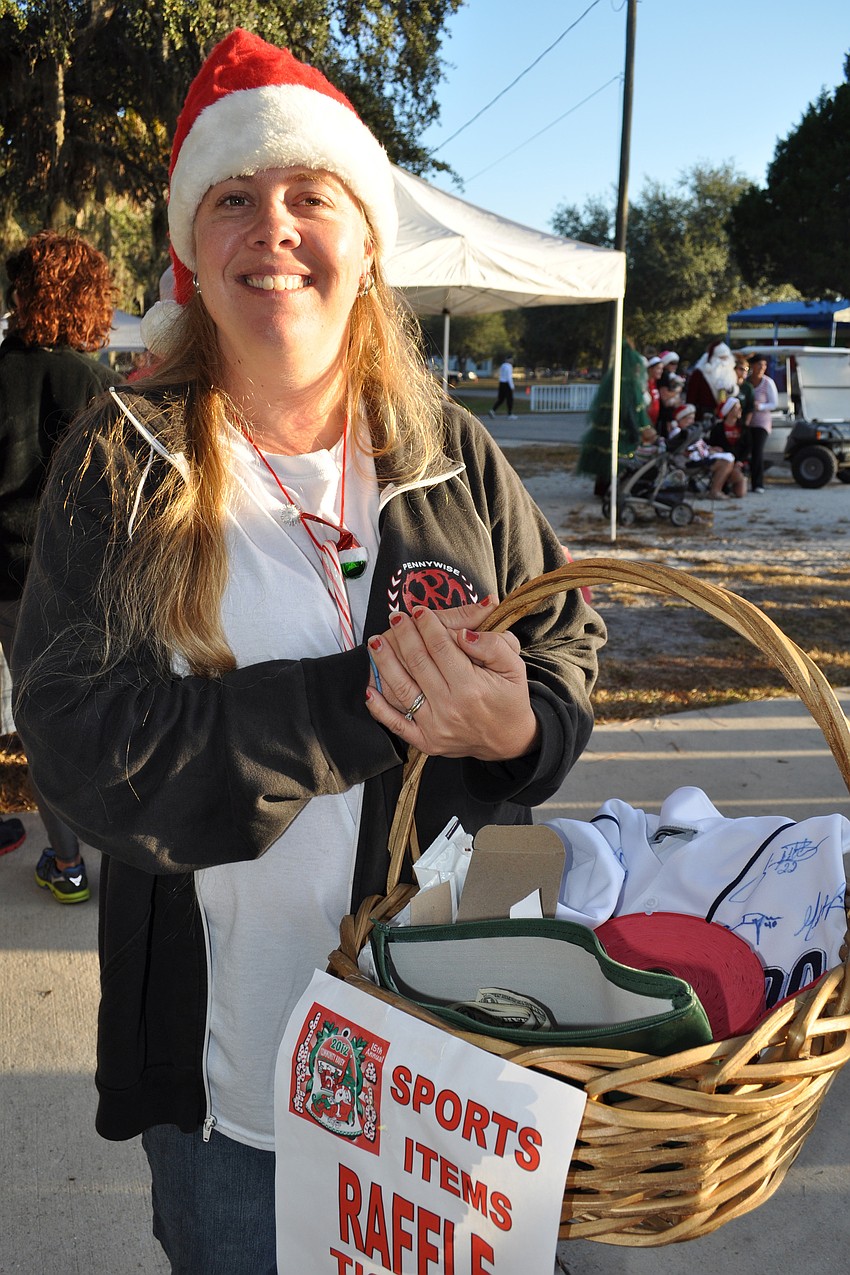 Penny Frederick sold raffle tickets for sports memorabilia.