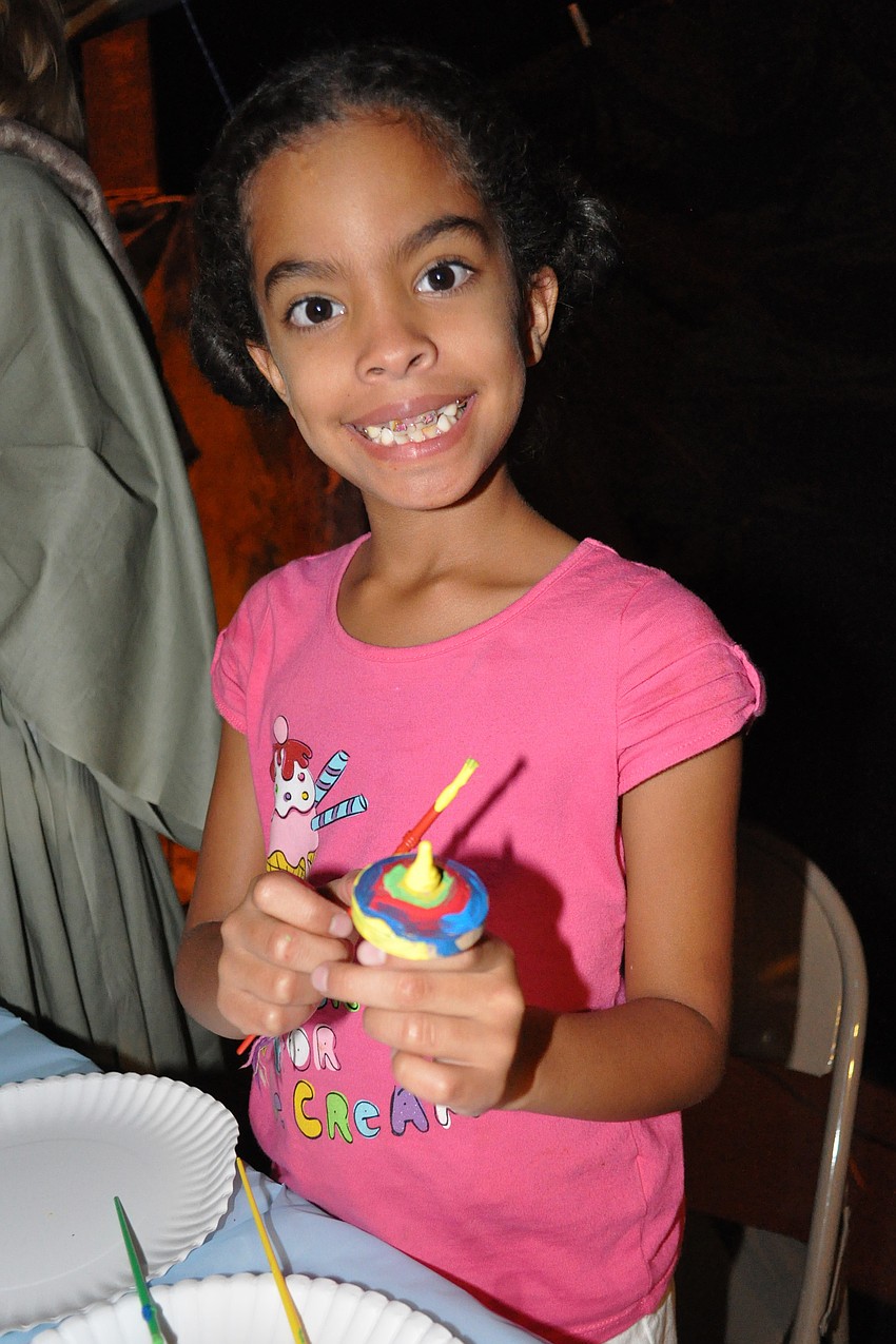 Crystal Crespo, 7, painted a top.