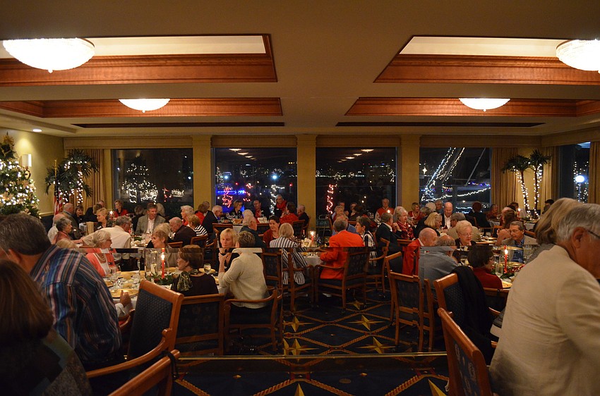 Bird Key Yacht Club members sit down to dinner after the blessing of the fleet.