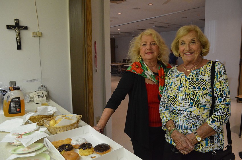 Marie Pogmore and Rosemary DeMarco get in line for breakfast.