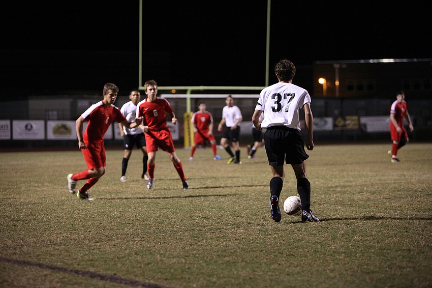 Bookerâ€™s Rudolpho Esqueda, No. 37, looks for a teammate to pass the ball to.