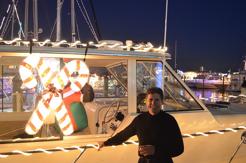 Greg Goebel stands next to his yacht Second Chance.