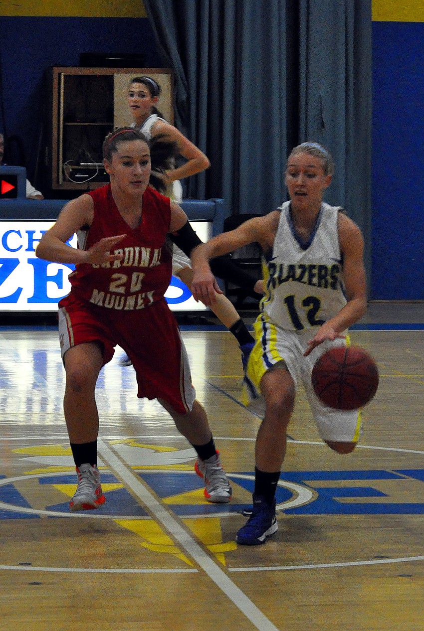 Cardinal Mooneyâ€™s Bridget Walsh, No. 20, tries to get the ball away from Sarasota Christianâ€™s McKenzie Lantz, No. 12.
