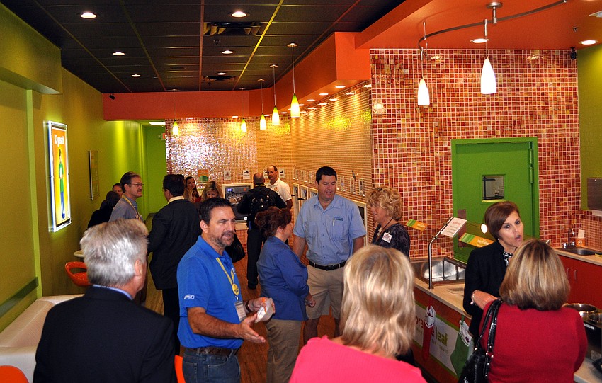More than a dozen people spent the morning eating breakfast provided by Chick-fil-A and tastings from Orange Leaf Yogurt Thursday, Dec. 13, at the Sarasota Chamber of Commerceâ€™s Breakfast with a BANG.