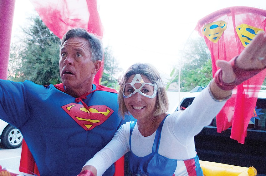 Teacher Ginger Rosenberger and her husband, Greg, set up a Superman-themed vehicle for trick-or-trunking  Phillippi Shores Elementary Schoolâ€™s Pumpkin Night, Oct. 25.