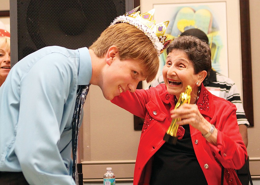 Audrey Kaplan crowns Ricky Gonzalez as the Prince of the Senior Senior Prom.