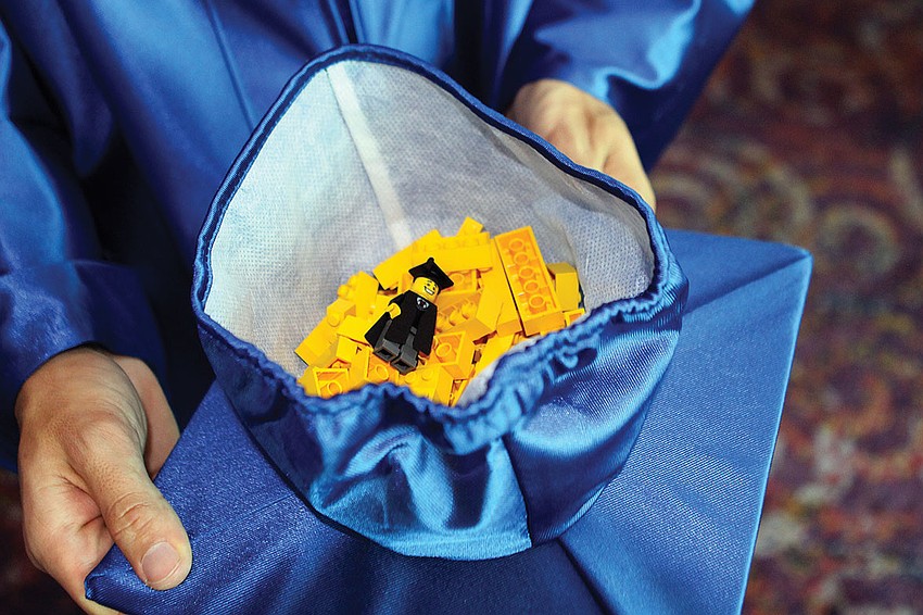 Pine View students handed Lego pieces to Principal Steve Largo as they received their diplomas.