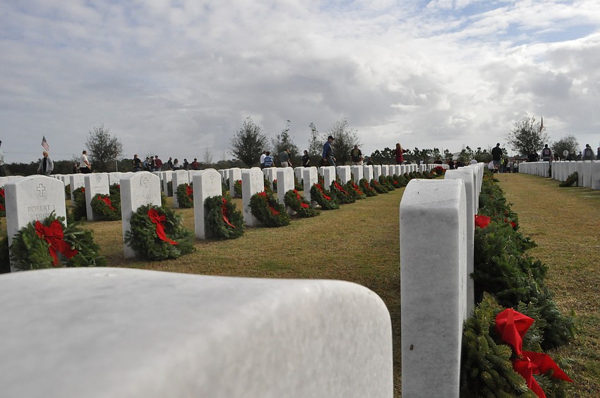 Each grave in the cemetery had a wreath by the end of the morning.