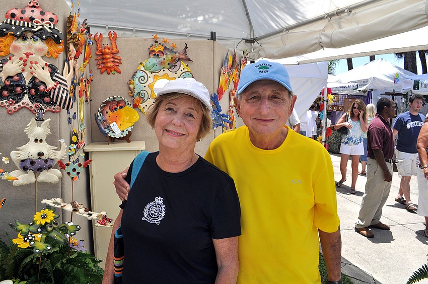 Irene and Al Hyman perused beach-themed art June 9 at the St. Armandâ€™s Circle Craft Festival.