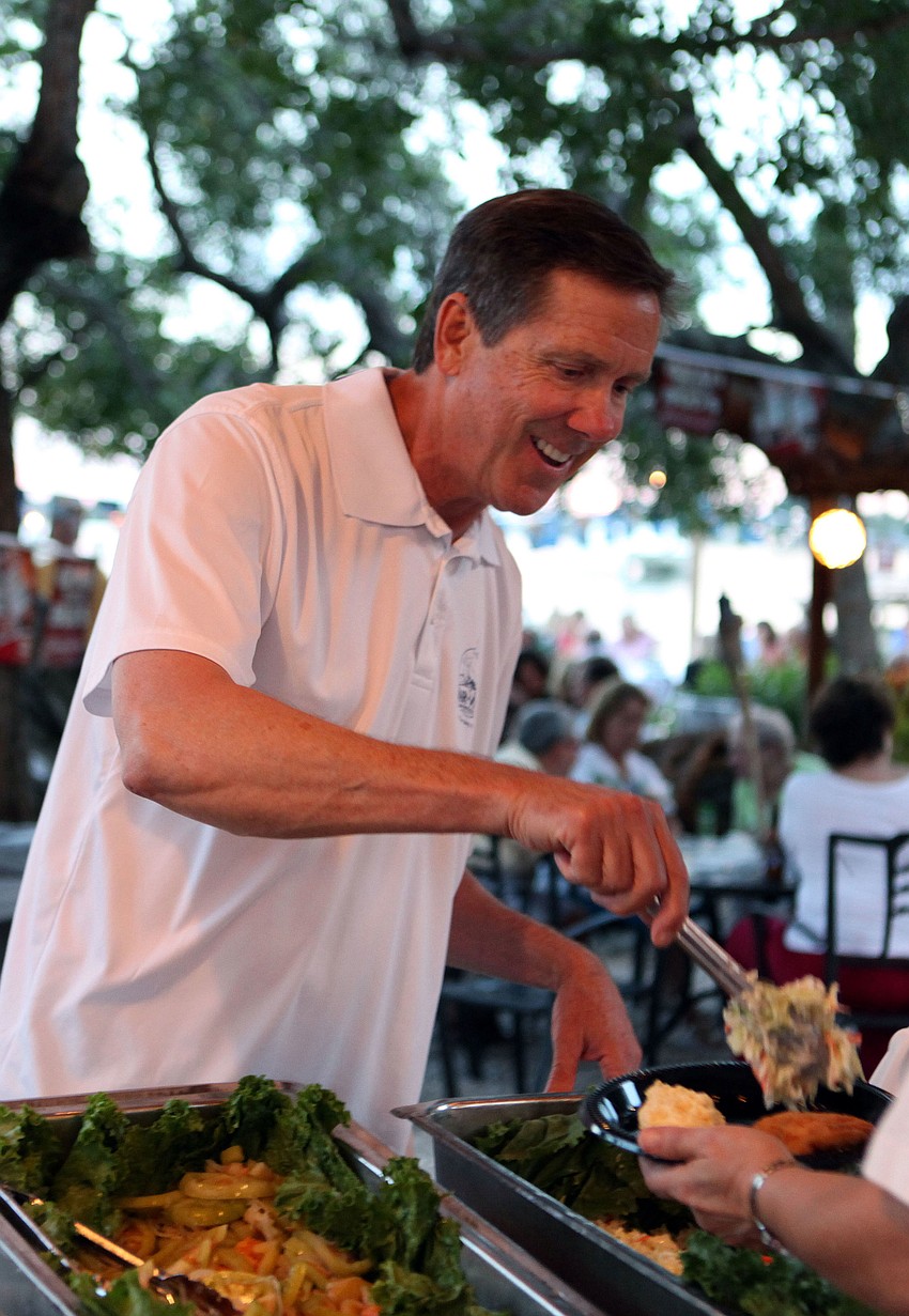 Ed Chiles served coleslaw Oct. 19 during the Old Time Fish Fry at the Mar Vista Dockside Restaurant and Pub to raise money for the Longboat Key Historical Society.