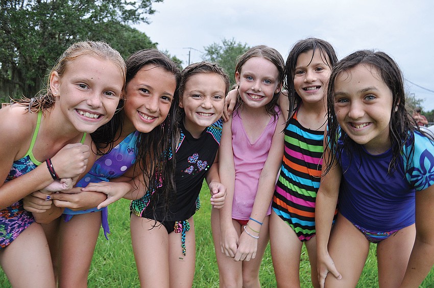Kayla Keane, Mackenzie Ramalho, Emily Wilcox, Dakota Kelly, Hannah Arduini and Jessie Dyson were eager to go on the water slide, during The Source Church's Water Day June 21. Published June 28, 2012.