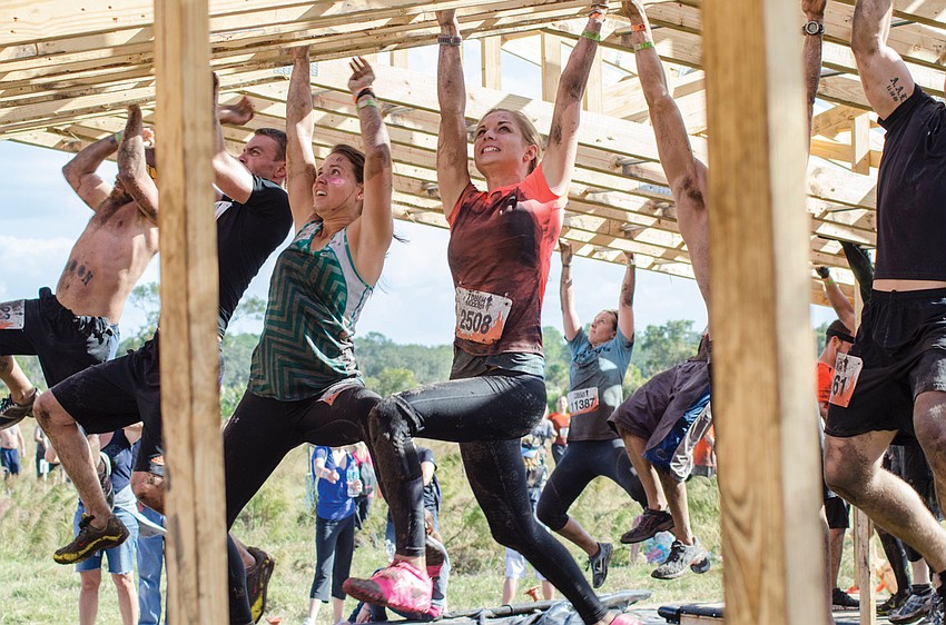 Participants tested their strength on the monkey bars, during the Tough Mudder challenge Dec. 1. Published Dec. 6, 2012.
