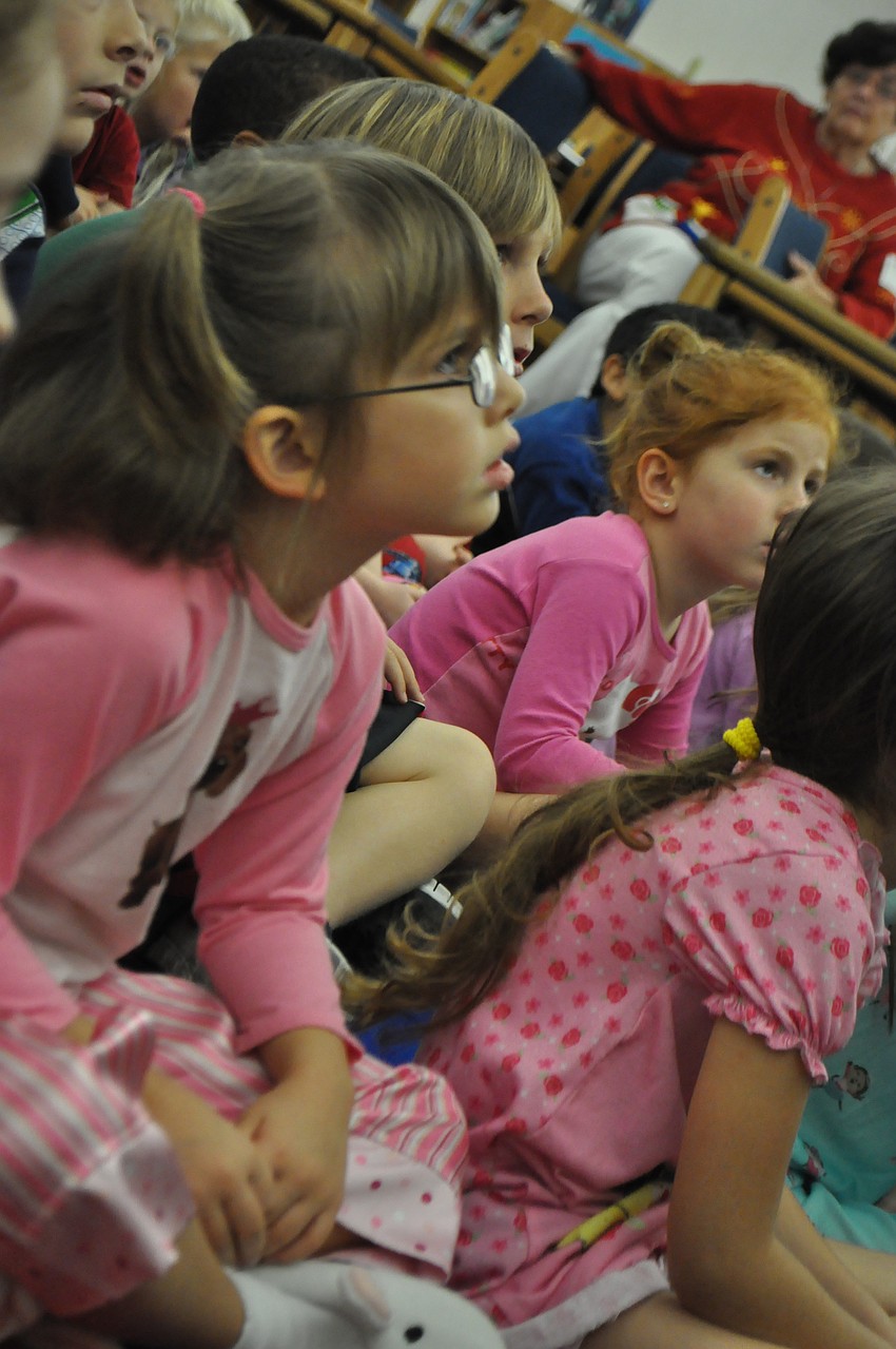 Faith Bossman listens to Patrick Sanders tell the story.