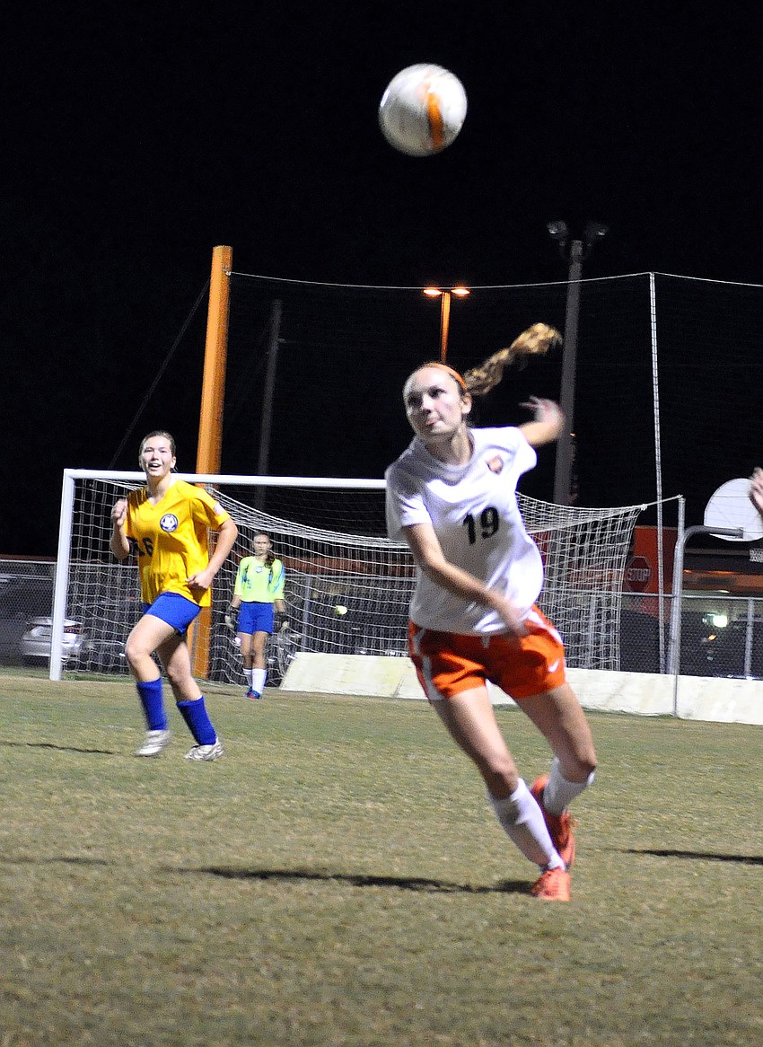 Sarasota High Schoolâ€™s Haley Stuart, No. 19, goes after a high ball.