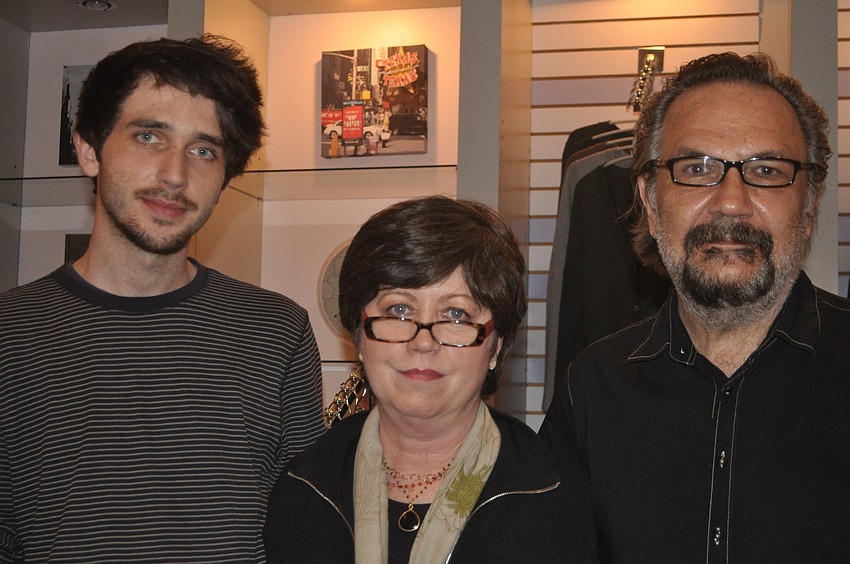 Pete, Debbie and Peter Stanick greet visitors at their shop, Exit Art, which specializes in womenâ€™s clothing, accessories and pop art.